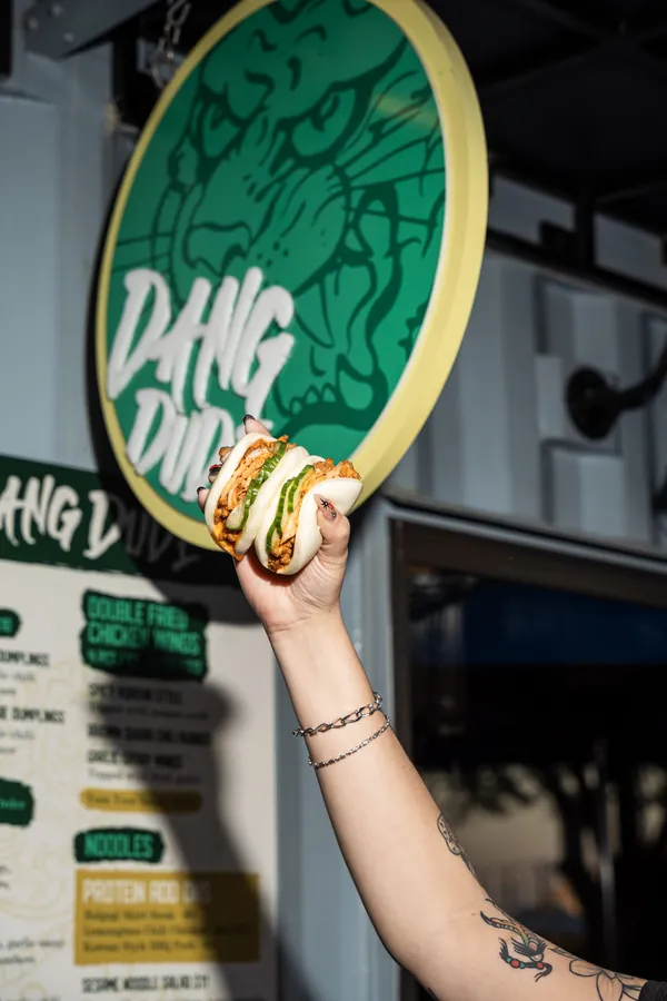 Bao bun held up at Dang Dude Sparkman Wharf
